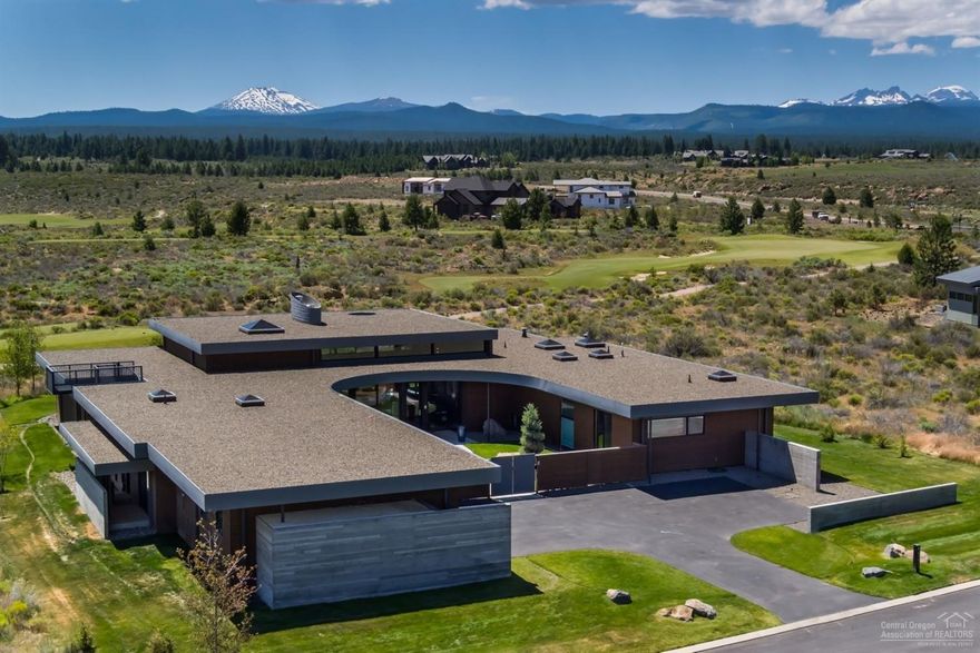 This estate, designed by Eric Meglasson of PIQUE collaborative, is a modern masterpiece w/ sweeping Cascade Mtn views. It features 4 suites, fitness room, office & great room w/ gourmet kitchen, dining areas, sunken bar, living room & fireplace. The exterior is perfect for entertaining w/ its dining area, large grill, hot tub, bar area w/ pass-through window, gas fireplace & gas fire pit. The masterful architecture displayed in this estate offers incredible continuity that brings the outside in.