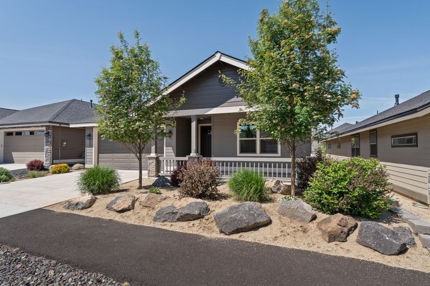 Beautifully designed for comfort and convenience! This home features two private ensuite bedrooms, an open living area with a cozy gas fireplace and wet bar, and a gourmet kitchen with quartz counters and stainless appliances. Enjoy a covered patio for outdoor relaxation. Located in a 55+ gated community with a new clubhouse under construction featuring an indoor pool, pickleball, gym, bocce ball, and second floor observation deck. Close to trails, golf, dining, and shopping. Move-in ready!