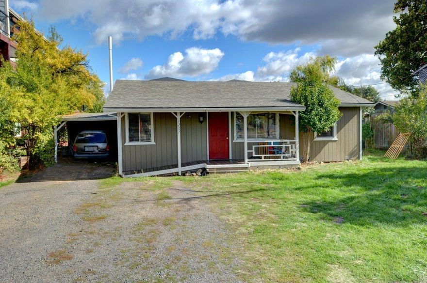 Large .24 acre lot on this 2 bedroom 1 bath home with carport/off street parking.  Covered front porch and large backyard with raised beds for gardening, great for entertaining or pets, makes this a real gem with an ADA ramp approach to home.  Plenty of storage in the kitchen, breakfast nook, ample sized bedrooms, and large laundry/multipurpose room.  Large storage shed for flex space behind the carport.  Zoning of CC allows for additional options of business, Airbnb, development etc...  Buyer to do due diligence regarding additional potential uses.  Don't wait, schedule a tour today!