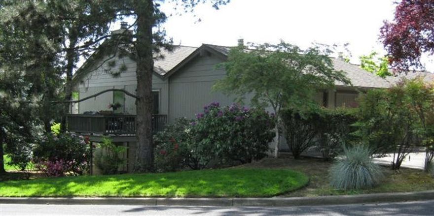 View from Roxy Ann to Mt. Ashland. Totally remodeled main level features an open floor plan with hardwood floors, custom wood cabinets with full extension drawers, Corian counters and new appliances in the kitchen. French doors in the office/bedroom open to private Trex deck. Bedrooms on lower level open to a covered patio and garden. This quiet, friendly neighborhood is close to schools, downtown, shopping, and Bear Creek Park. The double garage is finished and has loads of storage space.