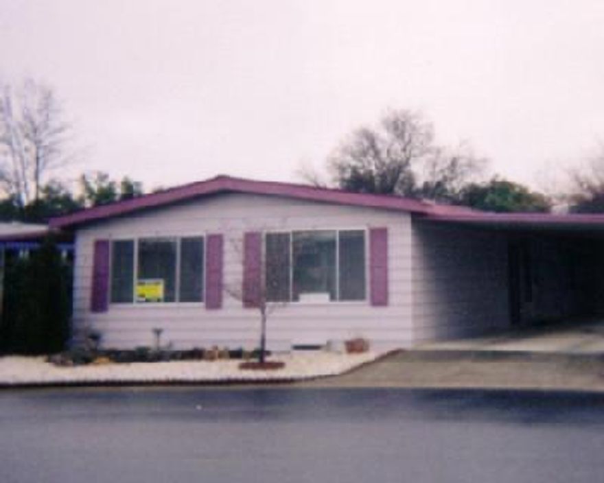 A delightful home in an adult mobile home park. Nice large living room, dining room has built-in china hutch. Kitchen has nice eating area. Large bedrooms with step in shower in guest bath. Two covered patios and nice storage shed. Space rent is $380 a month includes water, garbage, use of recreation hall, swimming pool & exercise room. Close to a small town and shopping outlets.