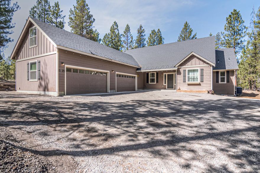 Beautiful, mostly all single level 4 bedroom, 3 full bath home on a forested 1.75 acre setting on a quiet cul-de-sac. This great property backs to hundreds of acres of forest service land with plentiful trails & wildlife. Open concept floor plan boasts 9 ft ceilings, tile counter & backsplash @kitchen, huge (40'X14') bonus room upstairs, gas fireplace, Bose surround sound system, wonderful bedroom separation, and to top it off: oversized (60''X22') finished 4 car garage with a workshop area! This incredible home offers privacy & room for toys. Level area for a future shop or barn.