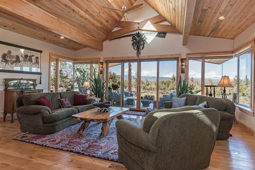 Panoramic Cascade Mountain views of the Three Sisters, Mount Washington & Three Fingered Jack include striking sunrises & sunsets over the juniper treetops. Custom built by the owner with thoughtful construction & intelligent design details, the main home includes a great room with vaulted beamed ceilings and picture windows overlooking the Cascade Mountains. Be warmed by the radiant floor heat throughout & the wood stove with a Montana Moss rock hearth. Entertain inside and out with covered outdoor living spaces. 38.76 Acres includes two residences; a 2,271 SF main house built in 2015 & 1,542 SF guest house built in 1915 (3,813 total SF of living space); large shop with an office; horse stalls, tack room & covered hay area; greenhouse & storage building. Baths include 2.5 in the main house, 1 in 1915 house, & 1 in the shop. Corral your horses and provide shelter with covered stalls and included fencing panels. Access to Cline Butte Recreational Area for hiking, horse riding and more!