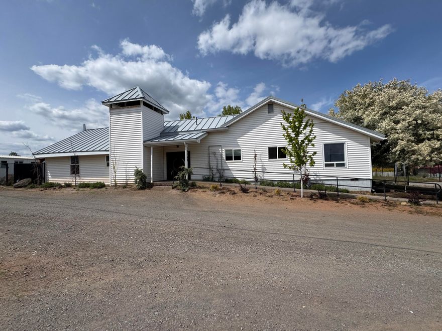 Step into serene country living with this beautifully remodeled gem in the heart of Bly—a quaint rural town rich with history & surrounded by nature. Set on a generous .5 acre lot, this nearly 5,000 sq ft home offers a blend of character, space & modern comfort. Inside you'll find meticulous updates throughout, including gorgeous new flooring, fresh paint, stylish fixtures, elegant tile work & updated plumbing-every detail thoughtfully curated to blend charm with functionality. Flexible floor plan includes huge gathering hall, once a church, perfect for get-togethers, studio workspace or home-based business. Outside enjoy room to park RV/toys or build a shop. Established greenhouse + expansive garden space. The fully fenced yard provides a great spot for pets & plenty of privacy to relax + unwind. Whether you're looking to work from home, host guests or savor peaceful rural life, this property offers endless potential in a quiet, welcoming neighborhood.