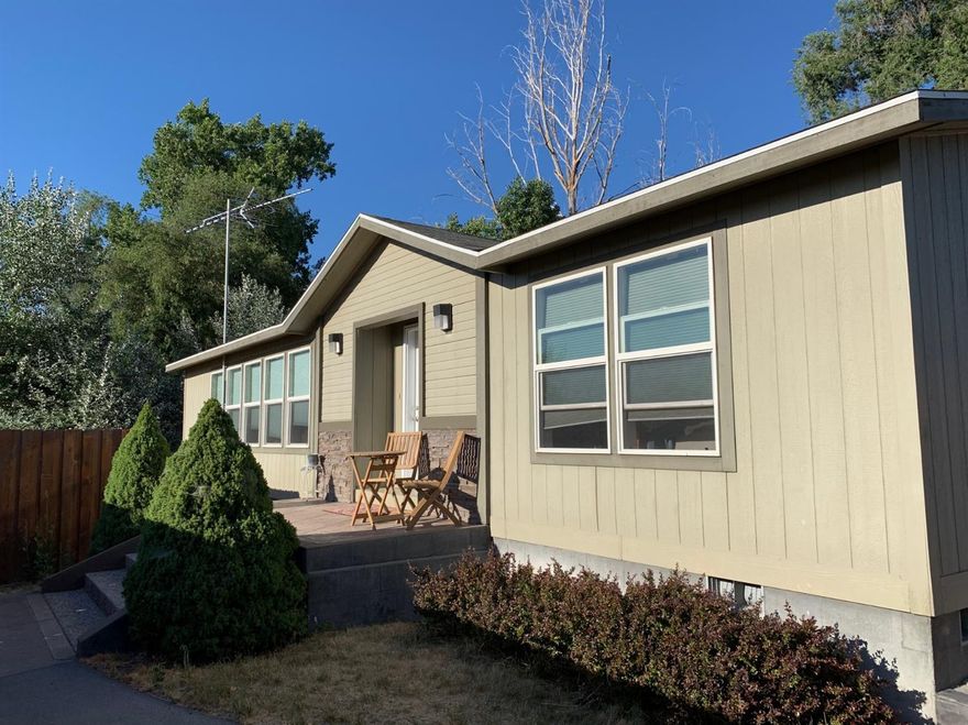 Well built manufactured home with 2 bedrooms and 2 bathrooms Open concept ,concrete sidewalks and patio 6ft Wood Fence Around The Property For Privacy, A 24x24 2 Car Garage with small office, Wrought Iron Fence for Entry,RV Parking and Insulated Shed.