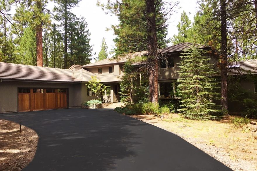 Enjoy the highly desirable Black Butte Ranch lifestyle on the 15th fairway at sought after Glaze Meadow Golf Course. Providing spectacular views this 4 bedroom, 4.5 bath home has been extensively remodeled with highly desirable amenities and features. With a spacious open floorplan and beautiful hardwood flooring through the main living areas, this light filled property boasts large windows to capture the golf and ponderosa pine views. The living room offers large vaulted ceilings and stunning stone fireplace that opens to the dining area - Perfect for entertaining. The heart of the home is the well appointed chef's kitchen with granite countertops, stainless steel appliances and breakfast bar that spills into the extra large great room, complete with yet another gas fireplace, eating/game area, high vaulted ceilings, expansive windows, window seat, bar area with wine refrigerator, and built in cabinetry.