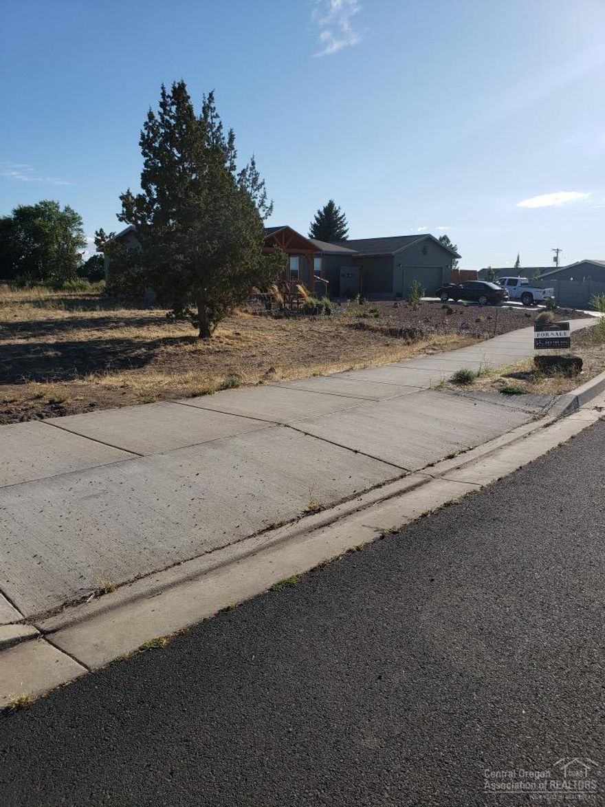 This lot has Mountain views, is close to schools, one of the last lots available in the city limits where a manufactured home allowed. Last lot in this subdivision. Beautiful neighborhood. Empty lot ready for a new home! All utilities are at the street including gas and cable.