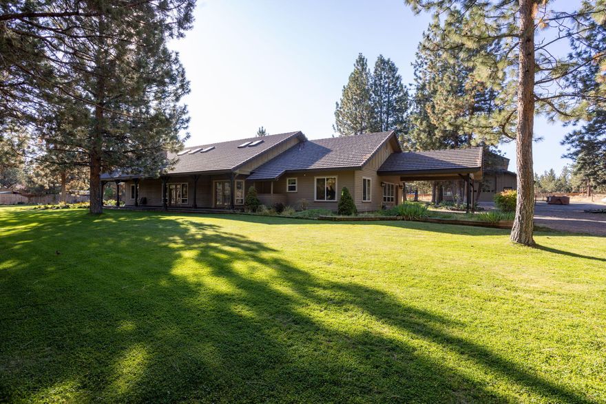 Discover this timeless 2900 +/- Ranch Style home, built for longevity and comfort w/ inviting porches on both sides. Nestled on 5 private acres, w/ irrigated lawns and flower beds, the property also features a 40x60 shop w/14x14 door. Inside, the quality shines through with custom hickory cabinets and sound-proof doors and walls, ensuring a serene living environment. The tile & laminate flooring throughout add both beauty and practicality. Each guest bedroom is a generous size, complete with large closets, while the Owner's suite boasts a spacious walk-in closet conveniently located off the bath. Stay cozy year-round with radiant floor heating, propane fireplace paired with a new efficient heat pump for both heating and cooling. Located on a private drive with a gated entrance, this home offers an added layer of privacy and security. Outside, you will find 4 fenced animal areas, a fenced garden area, a chicken coop, a gazebo and a great storage shed / tack room. Your dream home awaits