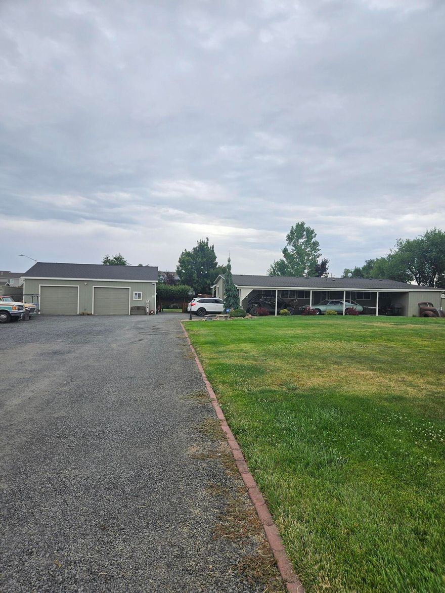 This home is perfectly modernized.  Open living, dining and kitchen.  Abundant windows for views and sunlight.  Cascade Mountain views.  Wonderful, newer 30X 40 stick built fully insulated with a cement floor and two overhead doors.  Large carport with RV hook ups.  The entire property is perfectly landscaped and ready to enjoy.  Large backyard porch.  Close to town, yet out of town.  Call your favorite agent today for a tour.