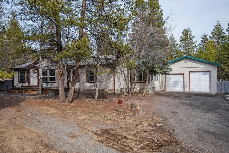 Just a little TLC will make this gem truly shine! At just over an acre and beautifully treed, this will make a wonderful Central Oregon retreat. A large, double doored shop with workshop and nicely finished artist studio will allow room for all your toys and creative endeavors. The koi pond provides an ideal place to unwind after a long day. Step inside to a nicely remodeled kitchen and real hardwood floors. Enjoy the sunroom for your morning coffee and watch the wildlife through the ample windows. A very special place - Come see it today!