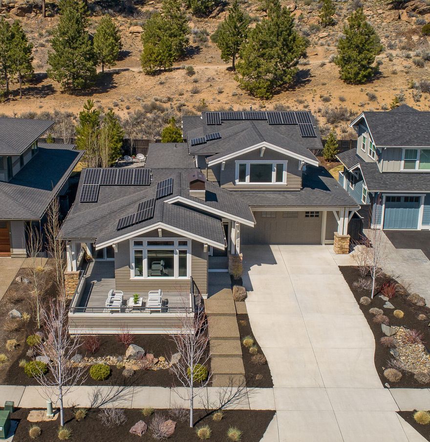 A stunning, like new Greg Welch built home in NorthWest Crossing embraces you with high-end finishes and timeless beauty throughout. The open concept will welcome you in with hardwood floors, high ceilings, abundant natural light and a cozy gas fireplace. The main floor living boasts an office/den, half bath, laundry and large primary suite, complete with a soaking tub, tiled shower and walk-in closet. Upstairs you will be greeted by an open bonus room, a built-in desk, 2 bedrooms and a full bath. The large front deck and tastefully designed backyard make for low maintenance outdoor spaces. All of your outdoor toys will have plenty of room in the bonus shop of the oversized 2 car garage. A 6KW solar power system boasts super low energy costs. Discovery Park, shopping and restaurants are just steps away!