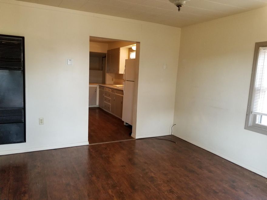 3 bedroom 1 bath home has a large kitchen and it has laminate flooring. It has a metal roof and a detached garage.