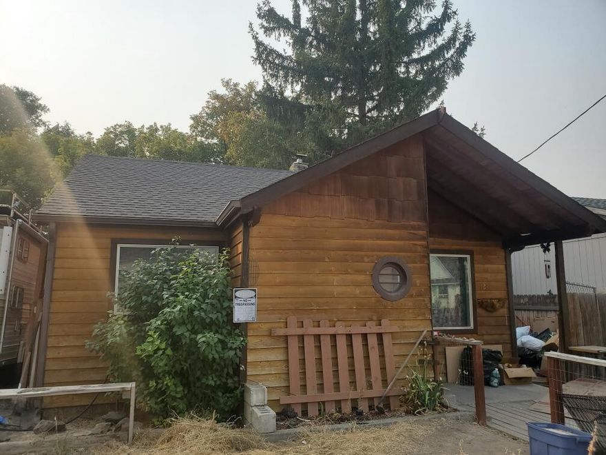 Hurry! Hurry! Hurry!! This home is being sold completely AS IS. So much potential for this home. 3 bedroom 1 bath. Spacious kitchen and laundry area. Spacious detached garage. Back yard is fenced. This home needs some TLC but is close to town and is waiting for its next family to make it their own.