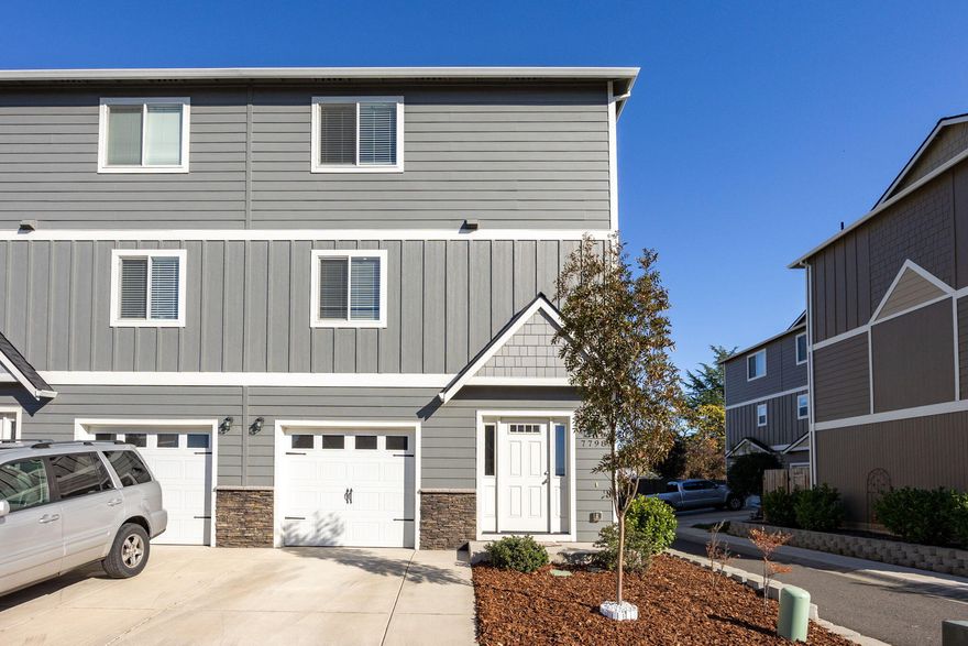 Beautifully Maintained End Unit! This 2 bedroom, 2.5 bathroom townhome located in a nice White City neighborhood. The first floor features a guest bedroom with it's own full bathroom, two closets and access to the garage and back yard. On the second floor, you will find an open concept kitchen with all Whirlpool appliances, dining area, balcony access, and a spacious living area and half bath. The large primary bedroom is located on the 3rd floor and features a walk in closet, additional linen closet, and a full bathroom with tub/shower combo. As a bonus, this home features ductless heating cooling systems for maximum efficiency and has new flooring throughout the home.  Washer/Dryer included. Just a great opportunity, ready and waiting for you!