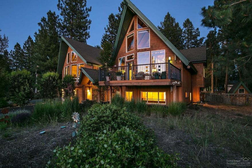 Local award winning architect designed home located in the iconic First on the Hill neighborhood offers rare multi-level space for families with artisanal craftmanship and ICF & SIP's construction situated on a large corner lot with old growth trees and Cascade Mountain views. This grand mountain chalet with modern amenities has 6 bedrooms/4 baths, a family game room with deck, large Lodge-style living room with stone floor to ceiling gas fireplace connecting the open kitchen and dining area that look out over the trees and expansive backyard lot below. Cathedral-style floor to ceiling windows, stained glass elements in a Frank Lloyd Wright inspired railing system throughout the home, a heated interior/exterior dog house, and other unique designed spaces throughout this home make it a must-see. The First on the Hill neighborhood with developed in the 1970's and was named for its' proximity to Mt. Bachelor. It is a neighborhood that honors the heritage of Bend.