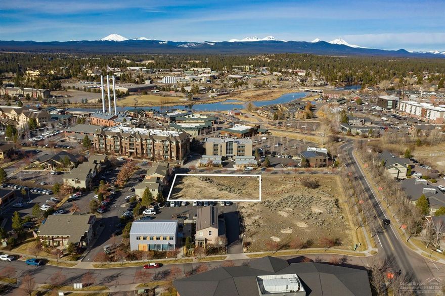 This .6 acre lot sits in an Opportunity Zone in the heart of the Old Mill and is ready for development. Planning documents exist with prior approvals for an 8-unit townhome project. Renderings and other planning documents attached. The mixed-use riverfront district (MR) is intended to allow for a variety of well designed commercial and residential properties, and encourage access to the Deschutes River. Boundary lines in photos are approximate.