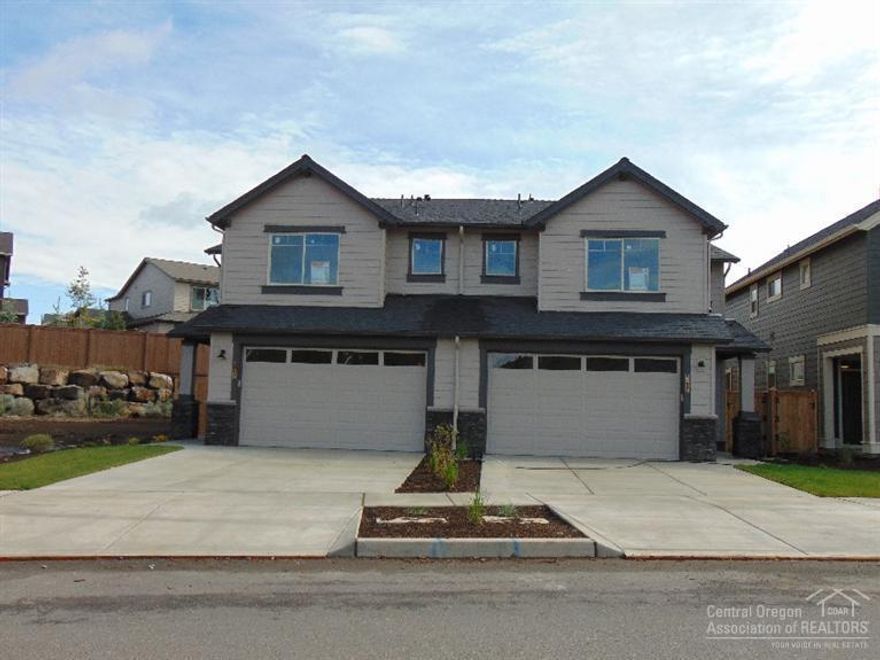The Brady is a beautiful two-story townhome with many great features and the quality Pahlisch Homes is known for - stainless steel appliances, laminate wood flooring and Chroma quartz counters w/under-mounted sinks (even in baths). Enjoy a spacious great room , upstairs loft with a coffered ceiling and beautiful master suite with walk in closet. 1,713 square feet, 3 bedrooms and 2.5 bathrooms. BRADY 2-A-1713-2 (RIGHT)