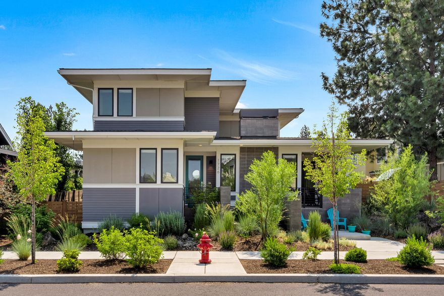Thoughtfully designed, sustainably constructed and lovingly cared for, this property in the heart of NWX is a home that strives to check all the boxes. Custom built by SolAire Home Builders in 2016, the design provides passive solar in the main living area while the 5 kilowatt solar panels on the roof power the home. The kitchen anchors the great room with solid surface counters and a high end appliance package.  Rounding out the first floor is a cozy fireplace in the great room, dining area, separate family room, office nook & full bath. Upstairs are four bedrooms and two full baths. The primary suite is highlighted by a private sauna and a large tub shower combo. The flat, south facing yard is accessed off the kitchen/dining area with a covered patio. There is an attached three car garage with plenty of room to store bikes, skis, and additional Central Oregon gear.  Located a few blocks from the newly constructed Market Hall, with easy access to schools, parks & endless trails.