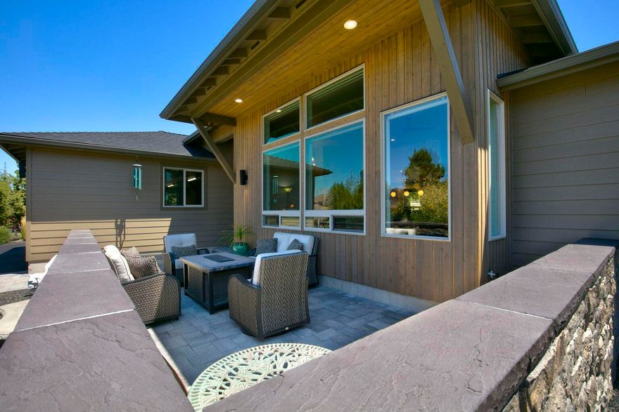 This stunning Northwest Contemporary home, situated on a quiet cul-de-sac in the award-winning Eagle Crest Resort offers a luxurious and amenity-rich living experience in the picturesque Central Oregon landscape! Ownership includes fitness centers, golf courses, pickleball and tennis courts, swimming pools, restaurants, trails, and more.. This single-level home features a stunning open-concept floor plan, and at the heart of the great room is a cozy gas fireplace, custom built-in cabinetry, & floating shelves, while at the center of the bright, open kitchen is a spacious island, perfect for casual entertaining. Seamless functional living space and modern finishes are found throughout the house. Enjoy the outdoors and take in the stunning sunsets from the expansive paver patio in the back or the cozy courtyard space in the front with impressive views of the Cascade Mountains. Don't miss this magnificent dream home!