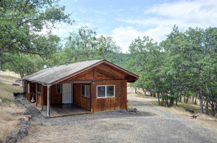 Are you looking for private property that has endless possibilities? This 12 acre property is usable, private, but only 10 minutes to Ashland. The 2600 square foot shop has separate electric, water and septic. The shop also has a wood stove to keep you warm in the winters. The cute cozy cabin/home is move in ready, has electric, septic, and propane. Zoned RR-00 this property allows for multiple outbuildings. There is a small horse corral/tack shop on the property that would allow for ponies/horses, pigs, or goats. The well produces 40gpm per seller. The water lines were completely re-done in 2012. The neighbors pay $600 a year to share the well. This is helpful to pay for taxes. This property would qualify for private financing, owner carry or cash. The cabin/home is NOT on a foundation which is a stipulation for traditional lending. Owner carry conditions would be $100,000 down for no longer than 5 years. This property truly is a great value and has endless possibilities!