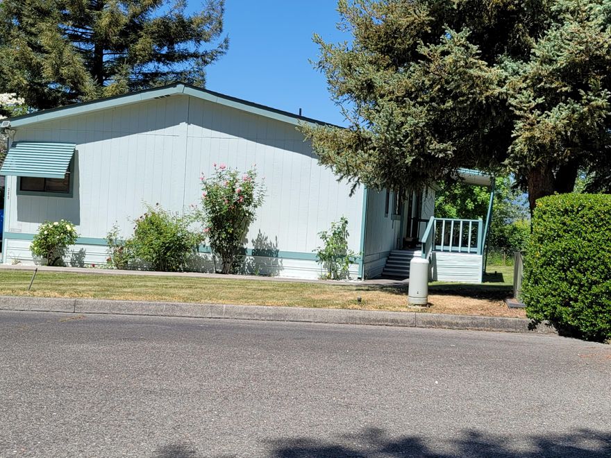 This adorable home is well taken care of, over 1700 SF, open concept, large yard, some furniture can stay if buyer wants. Fruit trees(two apple, one pear, and a grape vine) its on city sewer but has a community well at $10.00/MO GP irrigation is available and in use to irrigate the property. A new roof was put on in 2016, other upgrades from seller as well. This MF home had its engineering cert. in 2017.  Very close to shopping, gyms, hospital, schools, restaurants, and much more. By appointment only. Call and make your appointment soon.