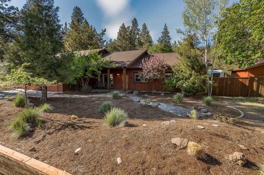 Welcome home to this enchanting single level residence on a beautifully treed .29-acre lot in a desirable NW Bend community that puts you in the center of it all! Private, fully fenced backyard is ideal for soaking in the sunshine or gathering under the stars after a day of play. 2,266 sq. ft. of well-designed living space provides for multi-generational living or income potential, with 4-bedrooms, including a lock-off suite with kitchenette, full bath, and private access, and an additional bonus room. Hardwood floors, vaulted ceilings, skylights, wood burning fireplace, and abundant windows provide warmth and character. Attached 2-car garage has plenty of storage and a laundry area. An additional detached 2-car garage is well suited for hobbies and toys--and there is even RV parking. Located just minutes from downtown, NWX, Shevlin Park trails, and the Old Mill. Whether you are looking for an investment property or full-time residence, this home lives the Bend lifestyle in a big way!