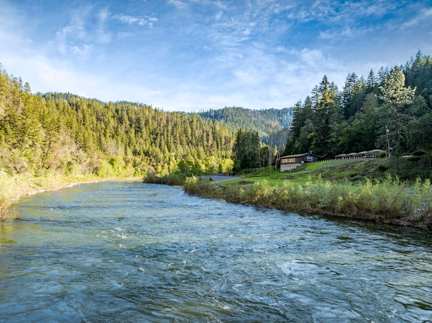 On the banks of the Wild & Scenic Rogue River, you will find a one of a kind destination - Galice Resort!  The public boat ramp is a popular location with rafters from around the world enjoying this slice of Oregon, & Galice Resort makes for a great place to relax & recharge from a day on the river.  The general store is stocked with gear, apparel, light snacks, & of course cold drinks!  The entertainment & food court makes for lively summer nights for locals & travelers alike - enjoy live music all summer!  Galice Resort features 10 lodging units starting with the one room Cabins, to the Galice Lodge as well as two homes ideal for manager/owner's quarters; nightly rates range from $159 to $699!  The resort sits on just under 13 acres of land located 15 miles from Interstate 5 & 20 miles from downtown Grants Pass.  This unique & special property is impeccably maintained & ready for new ownership - Come enjoy the wilderness and see what Galice Resort has to offer!