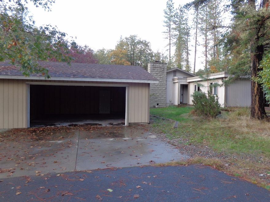 A Rural Property that's close to town. This is a Single Story 3 bedroom, 1.5 bathroom home on 1.30 acres. Kitchen, dining area, Spacious living room with brick fireplace, laminate flooring, Half bath is shared with laundry area. A detached over sized 2 car garage. Nice paved road to property. Near Rogue River High School. Not FHA/VA financeable. See attachment for PAS requirements and WFHM offer submittal information in MLS document section.