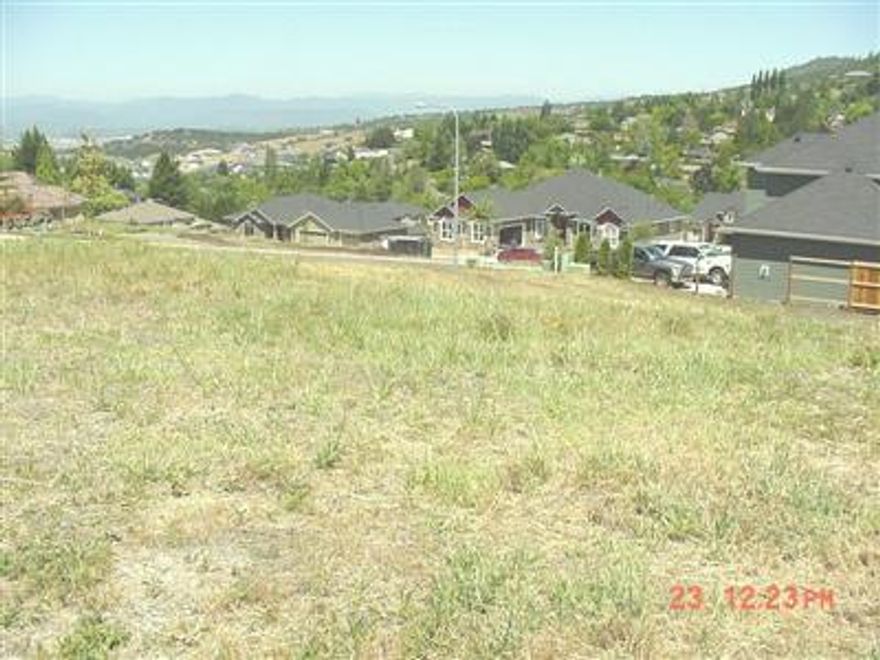 One of only a few lots still available in Crystal Heights. Upper end executive neighborhood with $700,000+ neighboring homes. Amazing unobstructed views from this large corner lot overlooking the East Hills, City lights & Roxy Ann. No contractor connection-Buyers may use any contractor of their choice. All utilities available at street. Perfect spot for your absolute Dream Home!