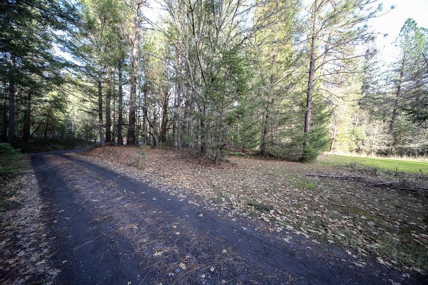 Time to build your dream home on 2.19 Acres with a wooded feel! Home site is Zoned RR 2.5 in an area of nice homes near the water. Seasonal creek on the property. Location is super close to the city of Rogue River, with easy access to 1-5 and with approximately 20 minutes to Medford, and 10 minutes to Grants Pass. Ideal for New Construction or a Manufactured home. Adjoining lot for sale is owned by same owner and is also on the market. Lot next door priced at $109,900.00. Buy both lots and have a 2-family set up, if still available. See MLS 3008687.