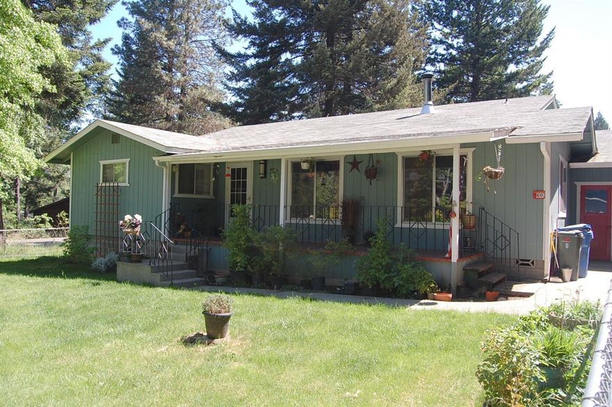 Open concept living room, dining room, kitchen, 3 Bedroom, 2 Bath, possible 4th bedroom or family room. New laminate flooring throughout the majority of the home, (seller is replacing the carpet in the den/4th bedroom with laminate). Covered back deck and covered front porch. Backyard has wood fencing for privacy and chain link fencing around the front yard. Utility shed off the back of the home. Home located on a large .35 acre corner city lot. Attached oversized garage/shop. Home Warranty offered.