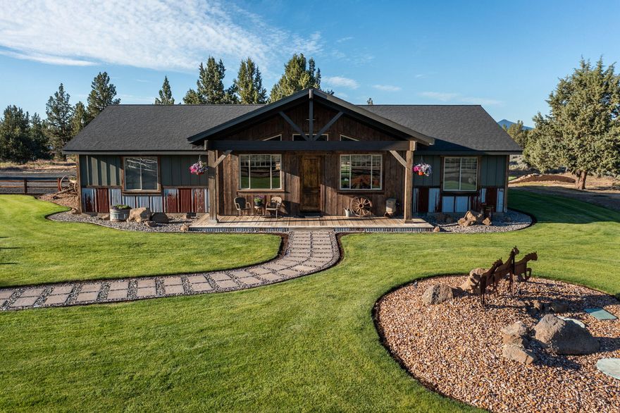 Introducing a one-of-a-kind custom home that is truly remarkable. This beautiful property features 4 bedrooms and 2 1/2 bathrooms, boasting an open floor plan with vaulted ceilings. The large kitchen offers ample storage, complemented by a custom antique island and cabinets. Adding to its charm are the 100+ year old beams and trim throughout the home, as well as the stunning barnwood flooring. The primary bedroom is a private oasis, complete with a walk-in closet and a spacious en-suite bathroom featuring a tile shower. With 7 acres of land, the property is fully fenced, providing both security and privacy. Step outside onto the expansive deck, perfect for enjoying the scenic views. Additionally, the property includes a 2-car garage, ensuring convenience and ample parking. Located in a prime area, this home offers easy access to Tetherow Park, the Deschutes River, Eagle Crest Golf Course, and BLM lands. Don't miss out on this exceptional opportunity.