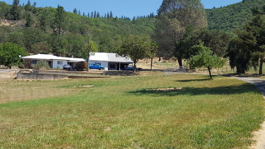 One-of-a-kind 33.56 acre parcel overlooking the peaceful town of Rogue River. Rambling 2,256sf home with 3 bedrooms, plus 4+ bonus rooms & 2 bathrooms-1 newly remodeled, & 2 new zonal heaters in 2 BR- set up now to accommodate extended family. Plus there is a 2nd Homesite pad w/elec, city water & septic, perched above a gentle rolling pasture. Next, there's moderate to steep forested land w/old logging trails & roads to bike or hike on adjoining BLM land. The higher you go, via the short & easy driveway to the top, the more spectacular the views of Rogue Valley & mountains-views that dream homes are made of! Appraised at $499,000. Serious health & parent-care issues motivate Sellers.