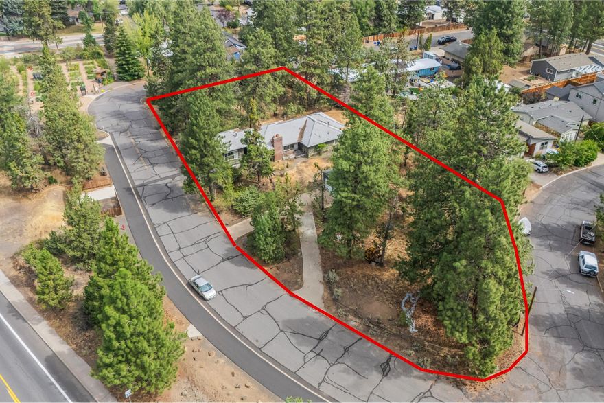 Seize the chance to own four expansive buildable lots in the heart of Bend, each spanning over 6,000 sq. ft. The possibilities here are truly endless. Whether you envision creating a multi-home community, crafting custom residences, or keeping the lots together to enjoy the already established custom-built 2,006 sq. ft. home on a sprawling .64-acre parcel. Nestled in one of Bend's most coveted locations, you'll find yourself just minutes from the vibrant energy of downtown, the shops and dining of the Old Mill District, the scenic trails of Pilot Butte, and so much more. Blending a prime location with incredible untapped potential, opportunities like this in Bend are few and far between. Don't miss out on the chance to call it yours.