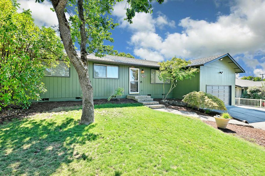 Set at the end of a quiet East Medford cul-de-sac, this 1,764 sq ft home offers 3 bedrooms, 2 bathrooms, formal living areas, and a bonus room. The remodeled bathrooms and kitchen with new granite counters, engineered hardwood flooring, and backsplash bring fresh updates, while recent interior and exterior paint add to the move-in ready appeal. A large backyard with mature landscaping and a covered patio creates the perfect setting for indoor and outdoor entertaining. With RV parking, space for multiple vehicles, and a prime location close to parks, shopping, and hospitals, this home combines comfort and convenience in a desirable setting.  Plus, the garage has fantastic storage and can fit most mid-size length vehicles.