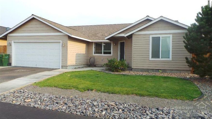 Come see this beautiful , spacious 1704 sq. ft. 4 bdrm, 2 ba. stick built home on a quiet street. Upgraded kitchen appliances, large pantry and custom backsplash. Newer carpet and laminate flooring throughout. Vaulted ceilings in the open concept living and dining room, electric fireplace, tiled hearth, and new ceiling fan make this space super comfy. Large landscaped, fully fenced backyard with sprinkler system. Dog run for the pups, and a 16 x 20 concrete patio for the family. Don't miss this home!