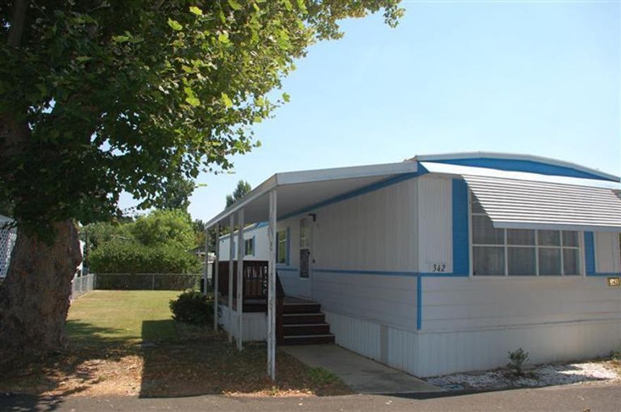 Modest and immaculate 2 bedroom, 1 bath home in Country Estates. 1976 - completely weatherized in 2008 with new double paned vinyl windows and insulation. and 3-years-new heat pump! Built-in vanities in master bedroom. Large 2-car carport with storage. Fridge, range/oven, dishwasher, washer/dryer. Furniture is negotiable. Country Estates offers beautiful treed acreage/grounds including a wonderful community garden and Rogue Riverfront with picnic area. $399 per month SPECIAL through June 1, 2013. New buyer must be approved with Park. Call JoEllen Yarrish, Manager (541) 476-2733.