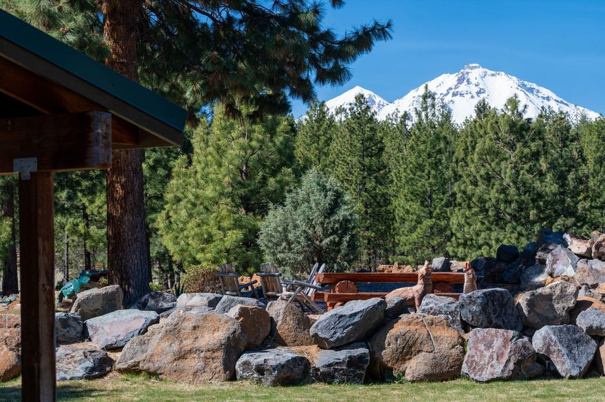 Discover the most peaceful and secluded 40-acre property with Cascade Mountain views and irrigation. This hand-scribed log home is tucked away at the end of Peterson Burn Road, backing directly to the National Forest for ultimate privacy.
Enjoy mostly single-level living with 4 bedrooms, 2 bathrooms, and 3,066 square feet of space. The home features large windows, hardwood floors, a beautifully updated kitchen and bathrooms, and a spacious living room with a stunning rock fireplace.
A separate dwelling offers an additional 2 bedrooms and 1 bathroom, with vaulted ceilings and an open floor plan—perfect for guests or extended family.
The property also includes a 4,000+ square foot barn with five horse stalls, hay storage, a tack room, and an attached 1,200 square foot insulated shop. The grounds are impeccably maintained, complete with a pond, a tranquil water feature, and fish.
This property is truly a hidden gem—come experience the peace and beauty for yourself!