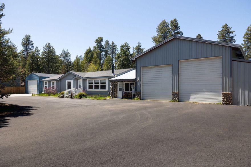 This fully fenced property sits on just over an acre, with two private electric gates and a smooth asphalt driveway, no gravel or dust. A massive shop with RV-sized roll-up doors and a breezeway to the main house offers space for projects, storage, home gym, or a bonus area. Plus, there's a detached two-car garage for extra gear and hobbies. Extra flex space has its own heating/cooling which is perfect for guests, a home office, or a creative studio. Enjoy peace, privacy, and room to grow, all just minutes from La Pine's amenities. Schedule your showing today!