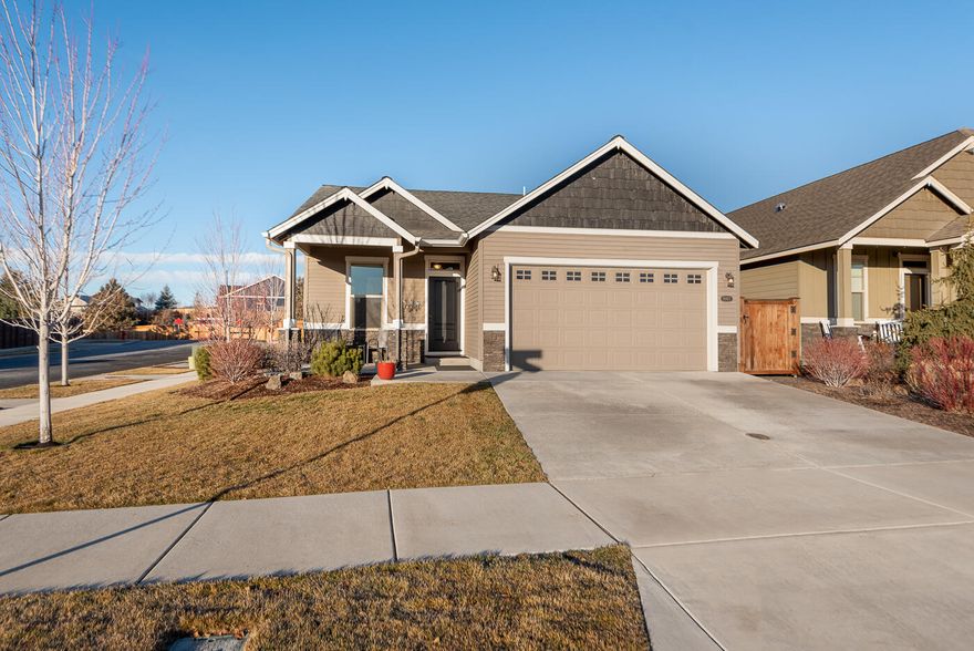 Discover this stunning single-level home in NE Bend, perfectly located on a private corner lot just steps from Rockridge Park! This spacious 4-bedroom, 2-bathroom home features an inviting open floor plan with a large kitchen, complete with custom cabinets quartz countertops, pantry, stainless appliances, wall oven and a generous L shaped island with seating for six, and ample storage. The luxurious master suite boasts a tile shower, soaking tub, dual vanity, and a walk-in closet. Engineered hardwood floors throughout all living spaces with carpet in the bedrooms. Enjoy outdoor living in the fully fenced and landscaped backyard with a covered back patio ideal for entertaining or relaxing.   Rockridge Park (1 block away) is comprised of 36 acres and includes disc golf, bike skills course, a fitness loop, paved and unpaved pathways, playground etc.