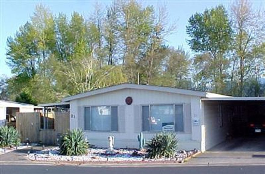 Beautifully remodeled manufactured home in 55+ Bear Lake Mobile Estates. Spacious interior features vaulted ceilings, formal dining and living room, family room, kitchen with eating bar, built-in china hutch and desk, and lovely master with garden tub. Exterior set up for entertaining with lovely desert landscaping with lighting and sensor light, wired for a hot tub, sun porch, 900 ft decking backing up to green belt. Finished office and outside shed a bonus. Seller will pay park rent for buyer thru January 1st, 2005. $418.00 park rent. Park pays water & garbage. Home warranty included.