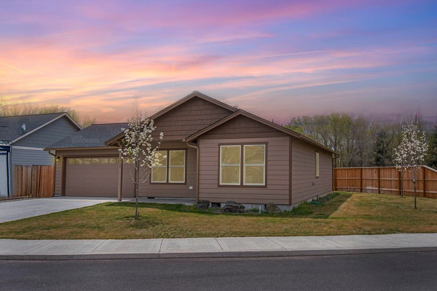 How much fun could you have living in this neighborhood? This corner lot home is on a cul-de-sac, bordered in back by a paved walking trail with the creek beyond that. The skate park, adventure bike park, pickleball, basketball, volleyball, bocce ball courts, playground and terrific green spaces are all within a block! This 3 bedroom, 2 bath home is like new and lives larger than the square footage! It features vaulted ceilings, walk in closet in the Owner's Suite, solid stone countertops, S/S appliances, laundry room with utility sink and a finished garage. The open floor plan allows for easy and comfortable entertaining. Enjoy warm evenings on the covered front porch, create a comfortable outdoor living space in the back or side yard or just take off to the parks!