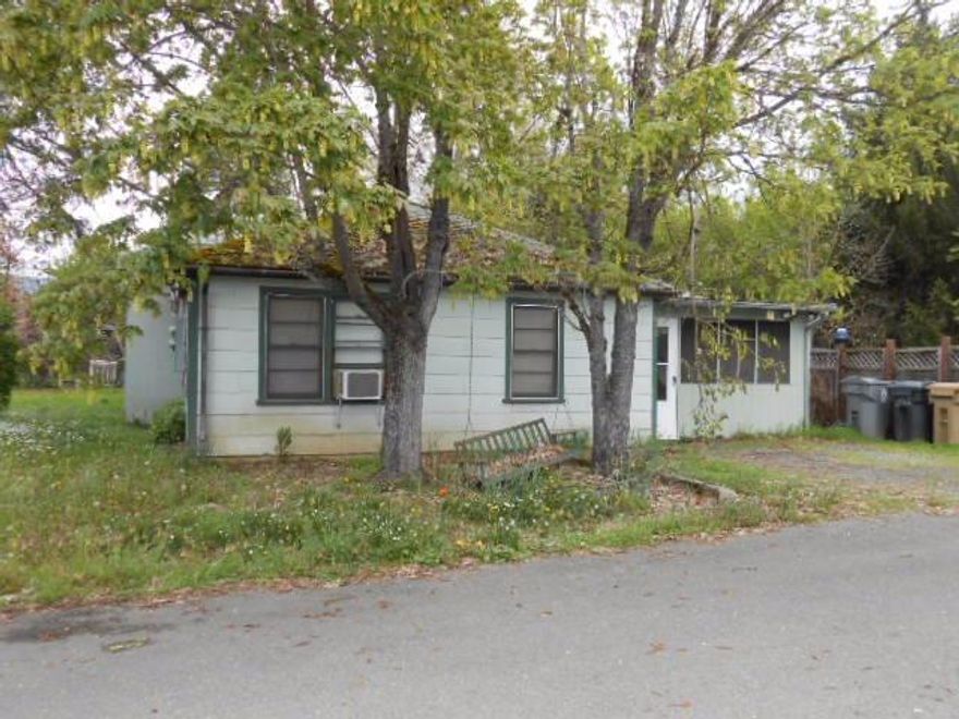 Here is a 3 bedroom, 1.5 bath home plus a detached garage with a 1 bedroom, 1 bath apartment. Located within 1 mile of all services. Home is 1 story and apartment is above garage.