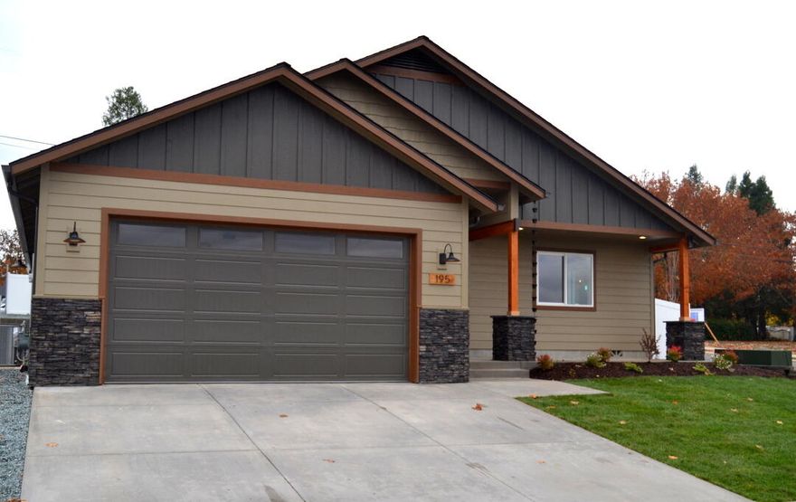 Brand new and just completed in November! This beautiful home sits in a desirable, family-friendly neighborhood and was designed for comfort, warmth, and everyday living. The spacious, private yard offers plenty of room for play or gardening, while inside, the open great room welcomes you with a floor-to-ceiling fireplace and natural light. The custom kitchen features clear hickory cabinets with soft-close doors, gas cooking, and rich hardwood floors throughout. Energy-efficient design keeps the home cozy and affordable year-round. The thoughtful floor plan makes the 1,654 sq ft feel much larger, with spaces that flow easily for gathering or relaxing. Built with care and pride by a quality local builder, this home is move-in ready and waiting for its first family. First time on the market