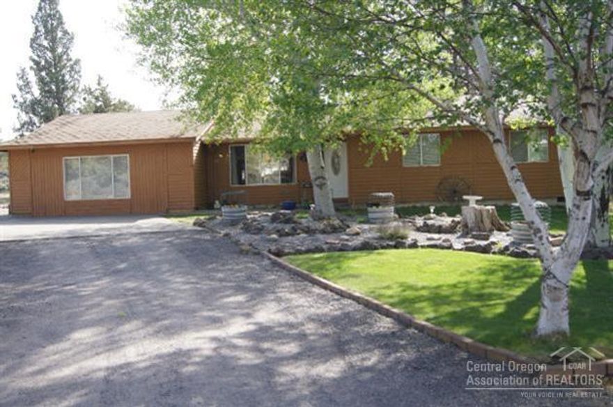 Enjoy the feeling of a warm, friendly welcome when you walk in the front door. Home is conveniently located between Bend and Redmond, close to medical facilities, shopping and more. Situated on a private 2.44 acres (+/-) with mature shade trees, RV parking, storage and much more. Home warranty included.