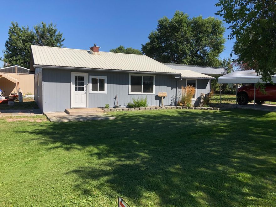 Come take advantage of this rare opportunity! .6 of an acres over sized lot in the heart of Terrebonne. This property has a large 24x27 shop, 2 additional storage sheds, a new 14x30 deck off the back of the house, and underground COID irrigation. The beautifully well kept home is just over 1,500 square feet with the garage converted into a generous sized primary bedroom.  The well appointed gust rooms are on the opposite end of the house rom the primary bedroom offering that extra privacy. This adorable mid century home also offers a dedicated dining room for traditional meals around the table. Schedule your showing right away!