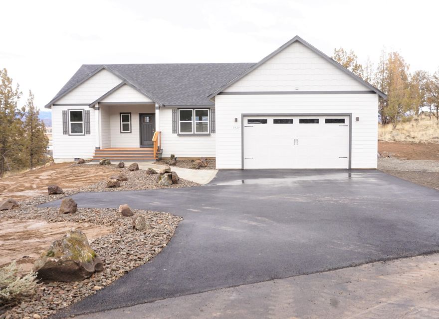 This Brand New single level 2250 sq ft home, completed December 2022 is a Must See!!  Stunning views of the Crooked River valley, city of Prineville, Barnes Butte, and the Ochoco Mountains! Featuring an open floor plan with 3 bed, 2.5 bath, large office, and utility room with sink on 2.19 acres with asphalt driveway leading into the 24x28 oversized garage with an 8' garage door. Vaulted ceilings in the kitchen, dinning room, living room, and main bedroom with large windows capturing mountain views. LVP flooring in the formal areas and Quartz counter tops throughout!  Large Kitchen with wood cabinets, island, eating bar, pantry, and Stainless Steele appliances too!  Main room separation with a huge walk in closet, soaking tub, tile shower and double sinks, large walkway to covered front porch, and 2 additional covered back patios with panoramic views. Comes with a 1 yr builder warranty. Conveniently located off Oneil Hwy just minutes outside of Prineville and only 20min to Redmond.