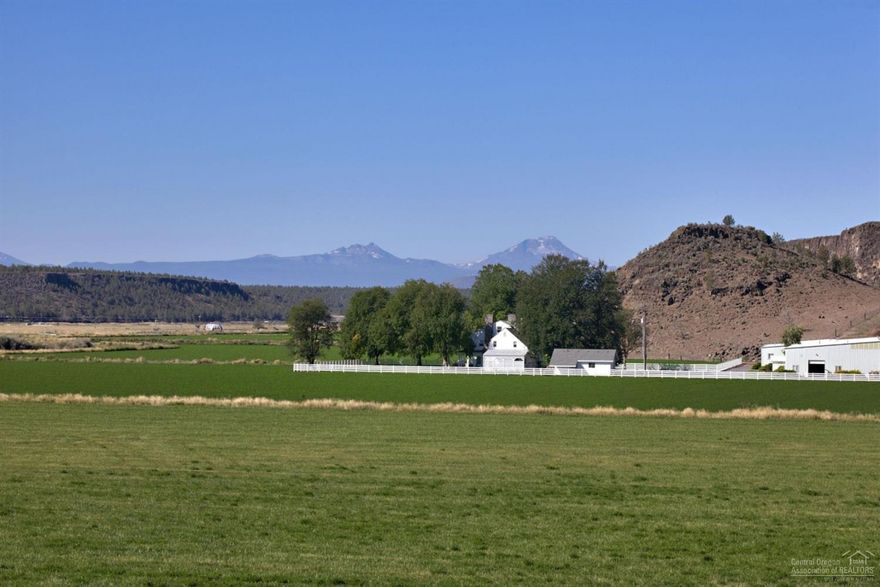 One of the Most Historical & Productive Ranches in Central Oregon w/over 579 acres & 461 acres water rights, most direct out of the Crooked River, which are free & very little pumping cost. Huge Cascade Mt & Smith Rock Views & set up against a beautiful Rim Rock. 4 homes, huge 100x300 indoor arena, 16-stall show barn, 14-stall mare barn, covered work area, 2 shops, equipment sheds, feed lot, corrals and scales. Everything is immaculate, gated pipe, laser leveled fields, many w/new seedings. CALL TODAY