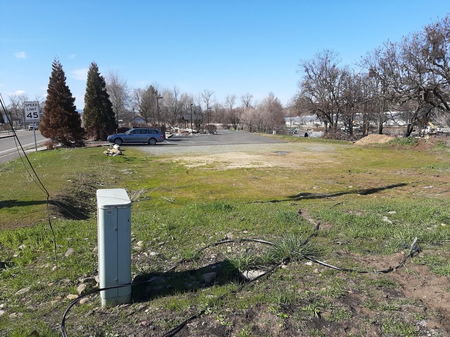 Price Reduced $10,000. Prime commercial land in Talent on main highway. Many allowable uses including partial residential. Check with city. Great location for home and office or shop. Access and detention pond already installed, utilities at property line. Unobstructed valley and mountain views. Possible seller financing. Survey and geotech report available. Listing agent related to seller.