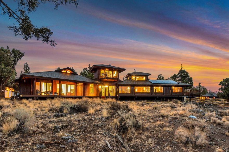 Imagine living at the base of the Cascade Mountains, overlooking the Three Sisters Wilderness and the Historic Tumalo Reservoir. Rare offering in Tumalo on nearly 100 private acres where your life will be overlooked only by the eagles. A one-of-a-kind estate that exudes an abundance of character and true western beauty. A remarkable home that preserves true craftsmanship and encompasses timelessness in this legacy property. Post and beam framing with wood accents throughout provide a warm yet elegant feel. In 2012, the original home had an extensive redesign adding mirrored wings and tower. Charming 2BR 2BA bunkhouse cabin with open floor plan, vaulted ceilings and cozy wood stove. Add in the thoughtfully designed horse facilities, barn, shop, and innovative remote-controlled irrigation system. Natural and exclusive with endless possibilities to satisfy your diverse palette, yet only minutes from Bend's city center.